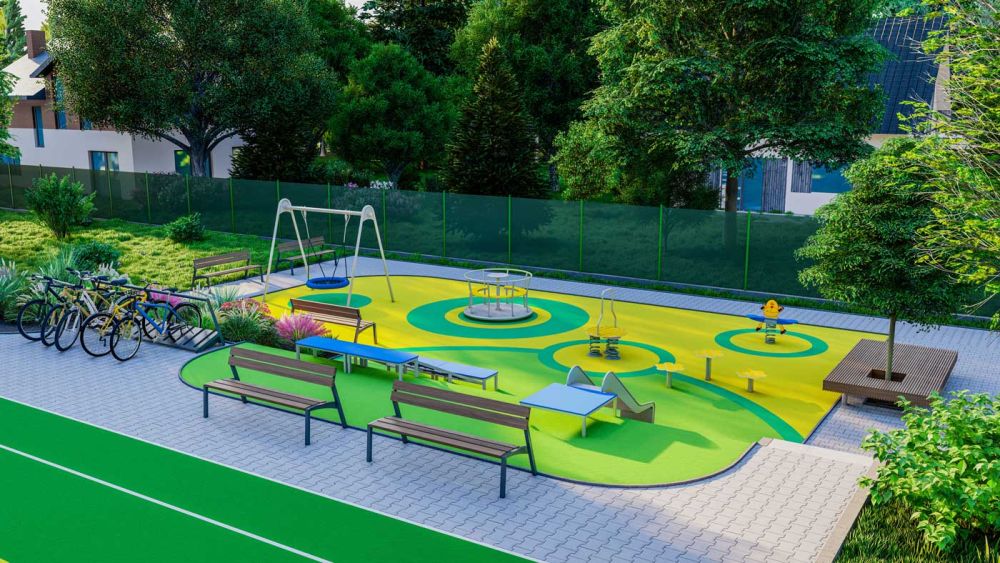Vielseitiger Spielplatz aus Vogelperspektive mit Sitzmöglichkeiten an jedem Bereich